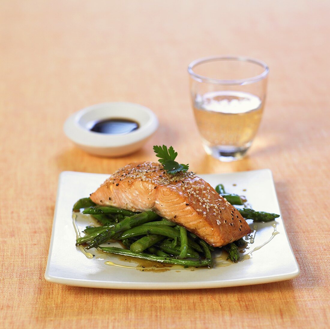 Salmon fillet with sesame seeds on green asparagus & beans