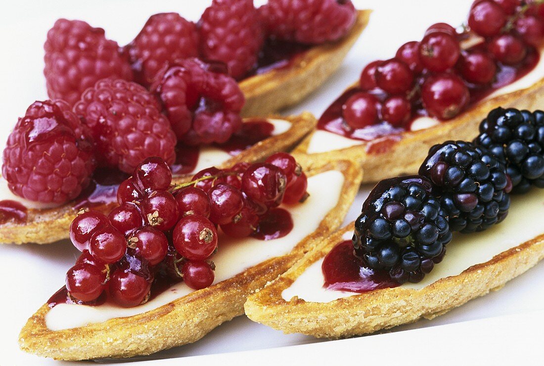 Sweet pastry boats filled with fresh berries
