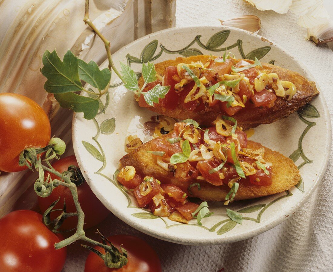 Two bruschette (Toast topped with tomato, garlic & basil)