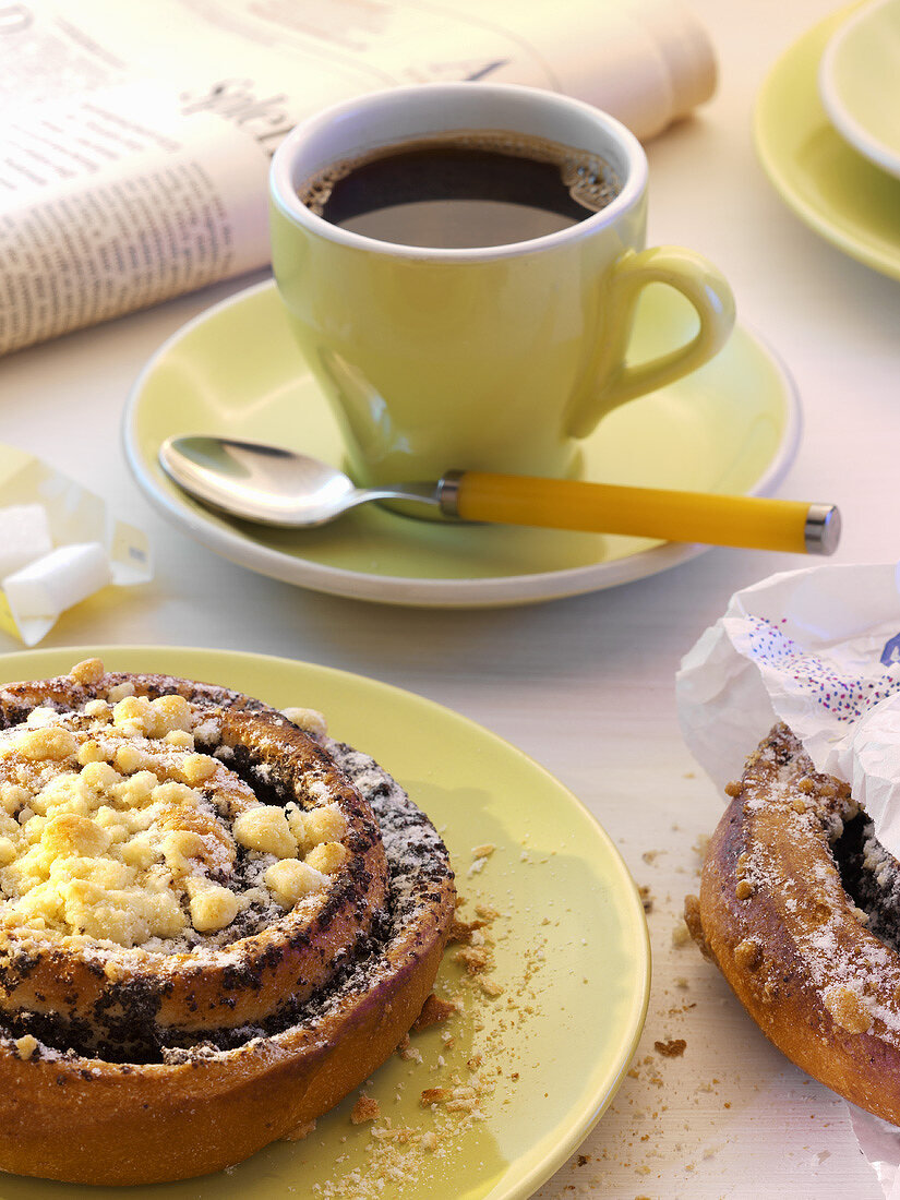 Poppy seed bun and a cup of coffee