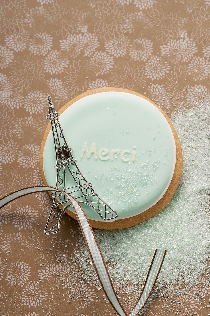 A Frencn biscuit with the word 'Merci'