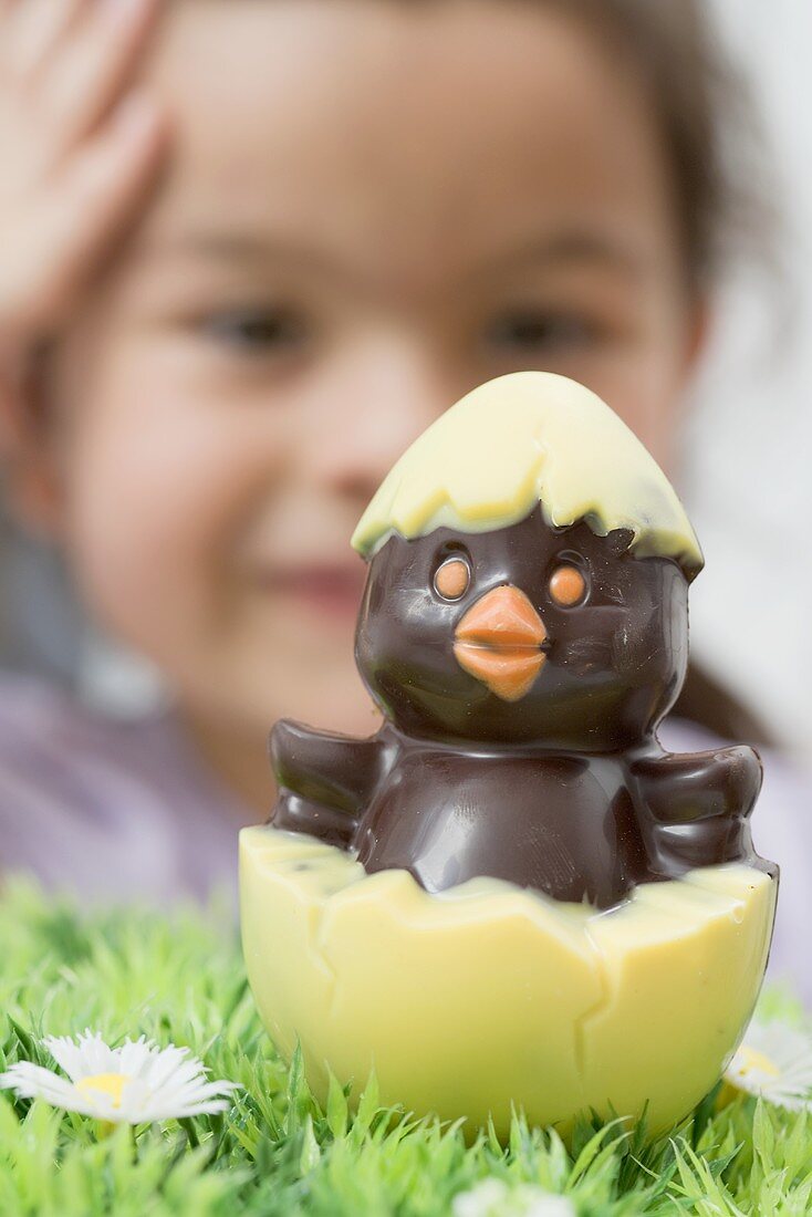 A chocolate chick hatching out of an egg (Easter)