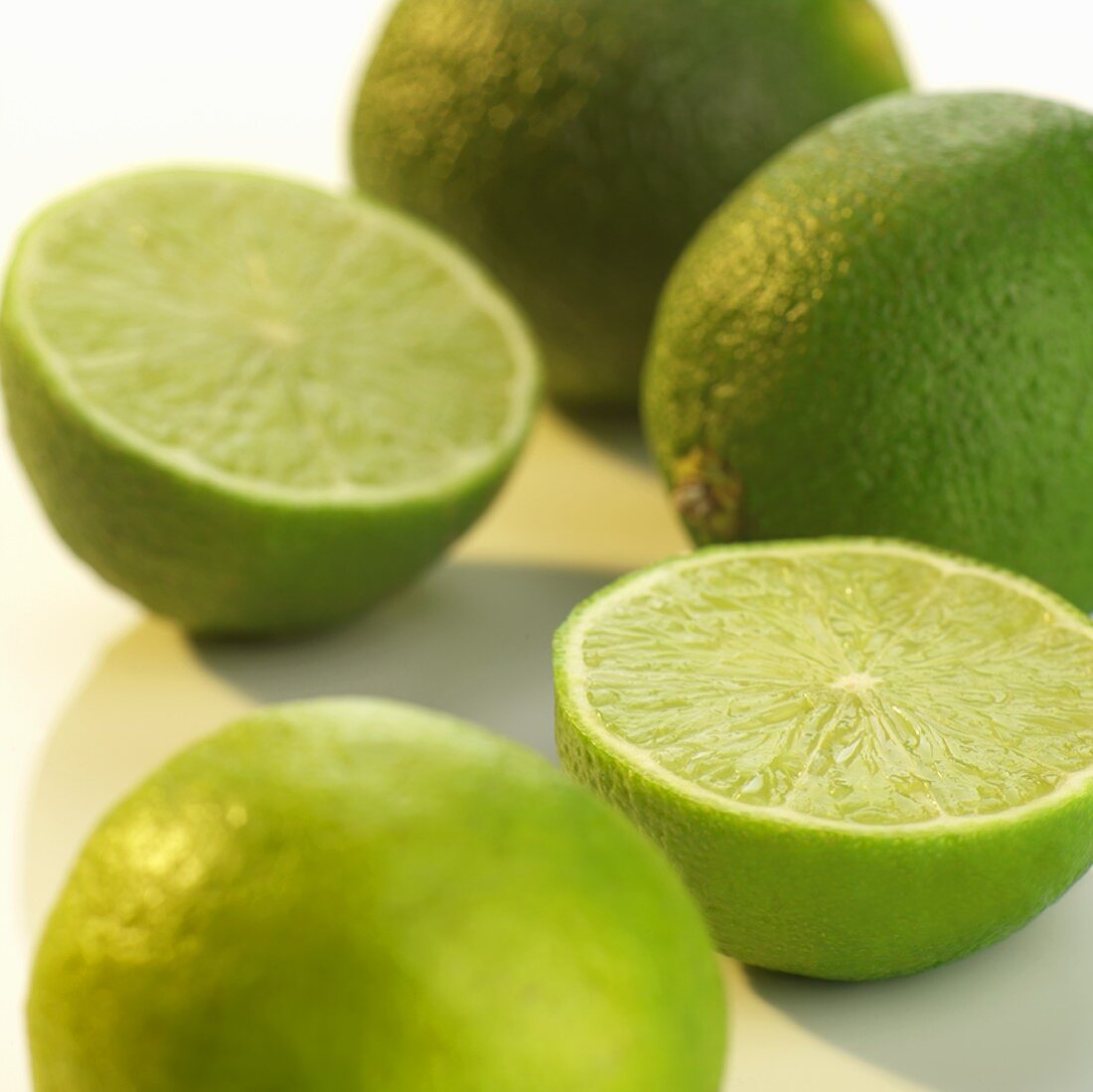 Whole and halved limes