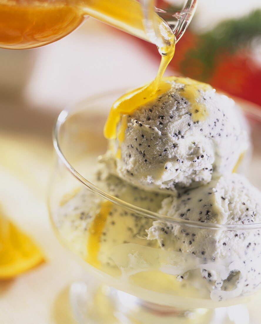 Vanilla and poppy seed ice cream with orange syrup