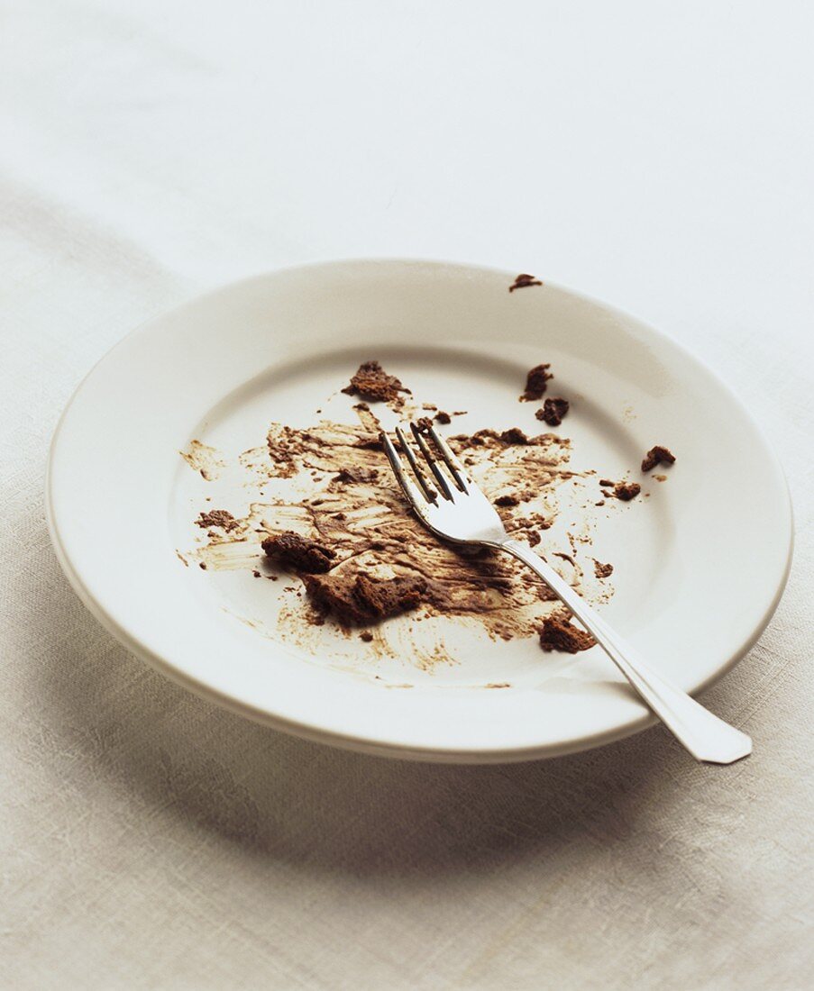 Plate with remains of chocolate mousse