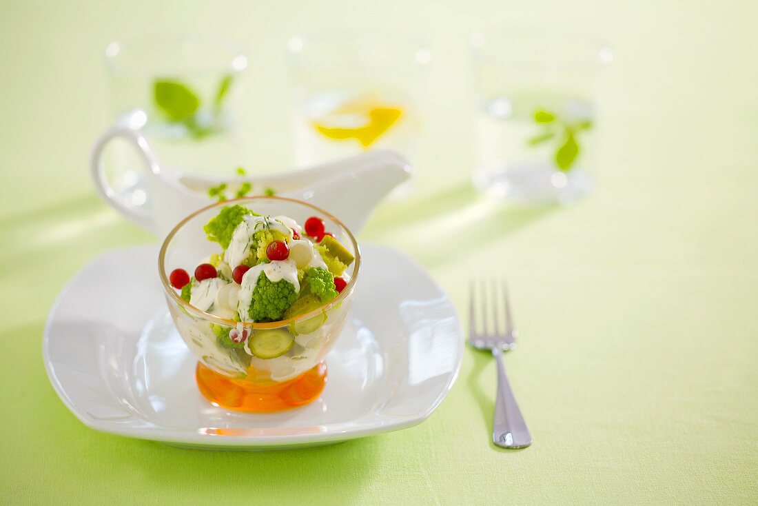 Broccoli salad with pickled vegetables and redcurrants