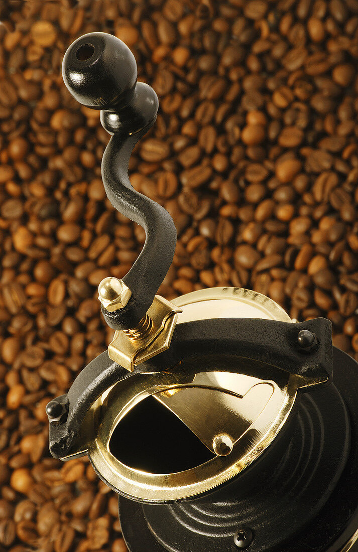 Coffee mill on coffee beans