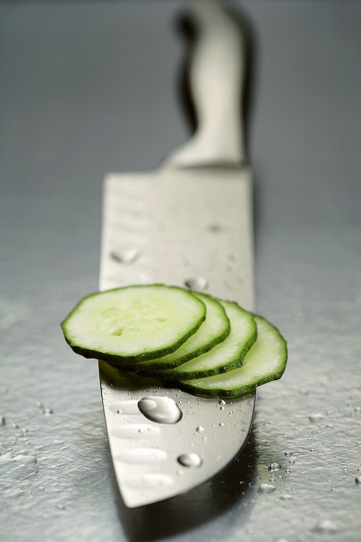 Cucumber slices on knife