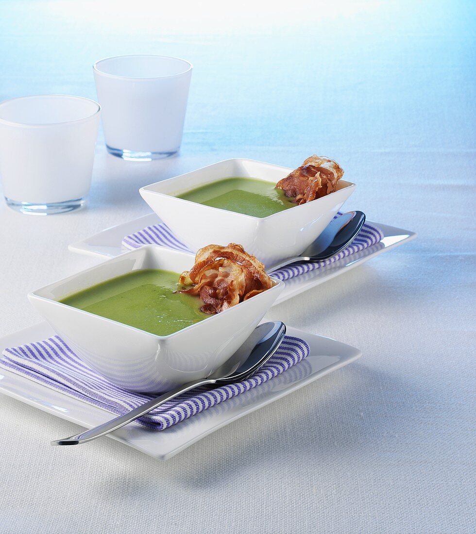 Cream of pea soup with slices of bacon