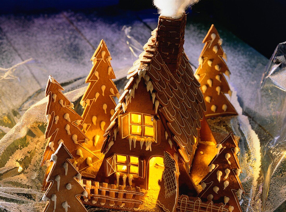 Decorated and Glowing Gingerbread House with Trees