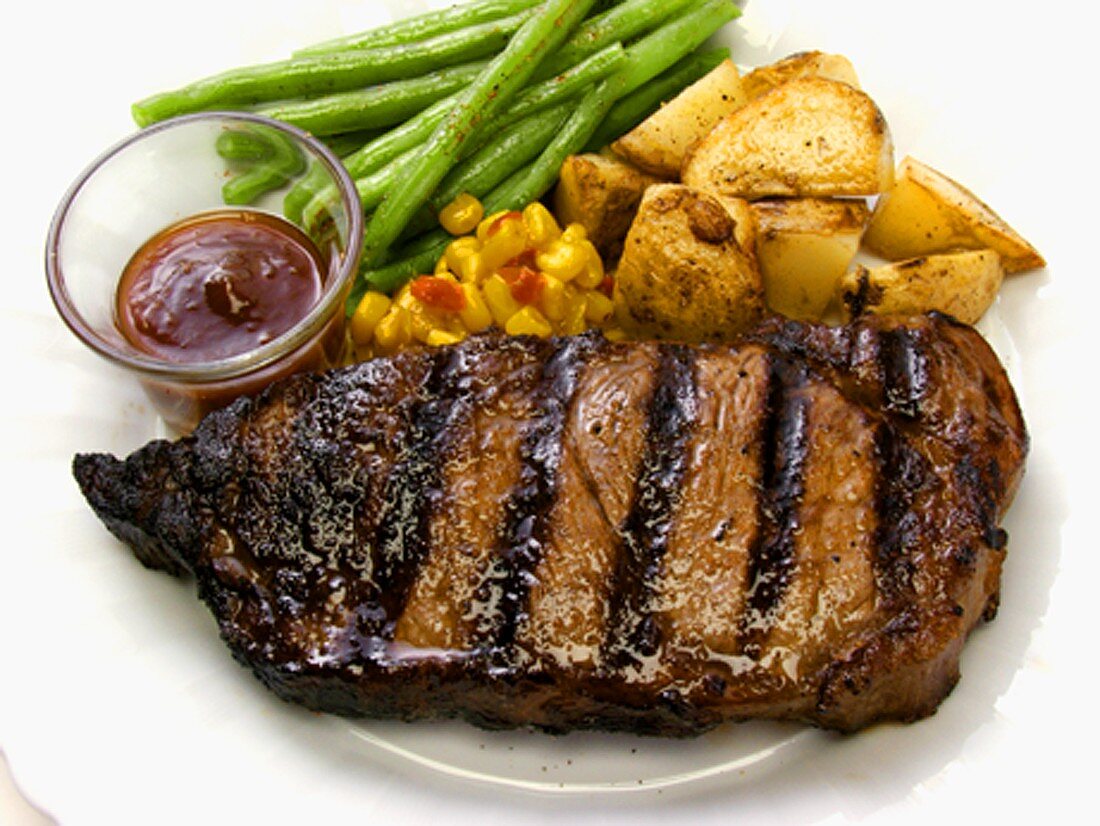 Grilled Rib Eye Steak with Potatoes and Green Beans
