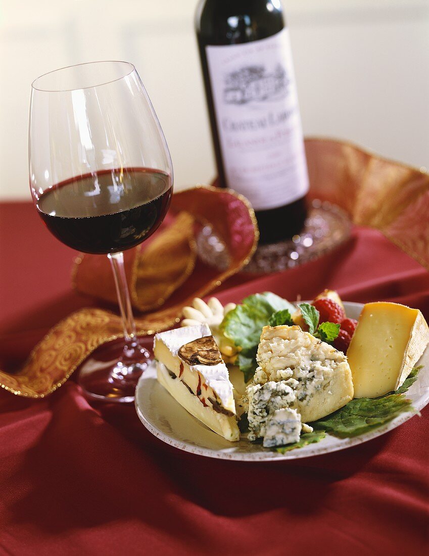 Cheese Plate with Glass and Bottle of Red Wine