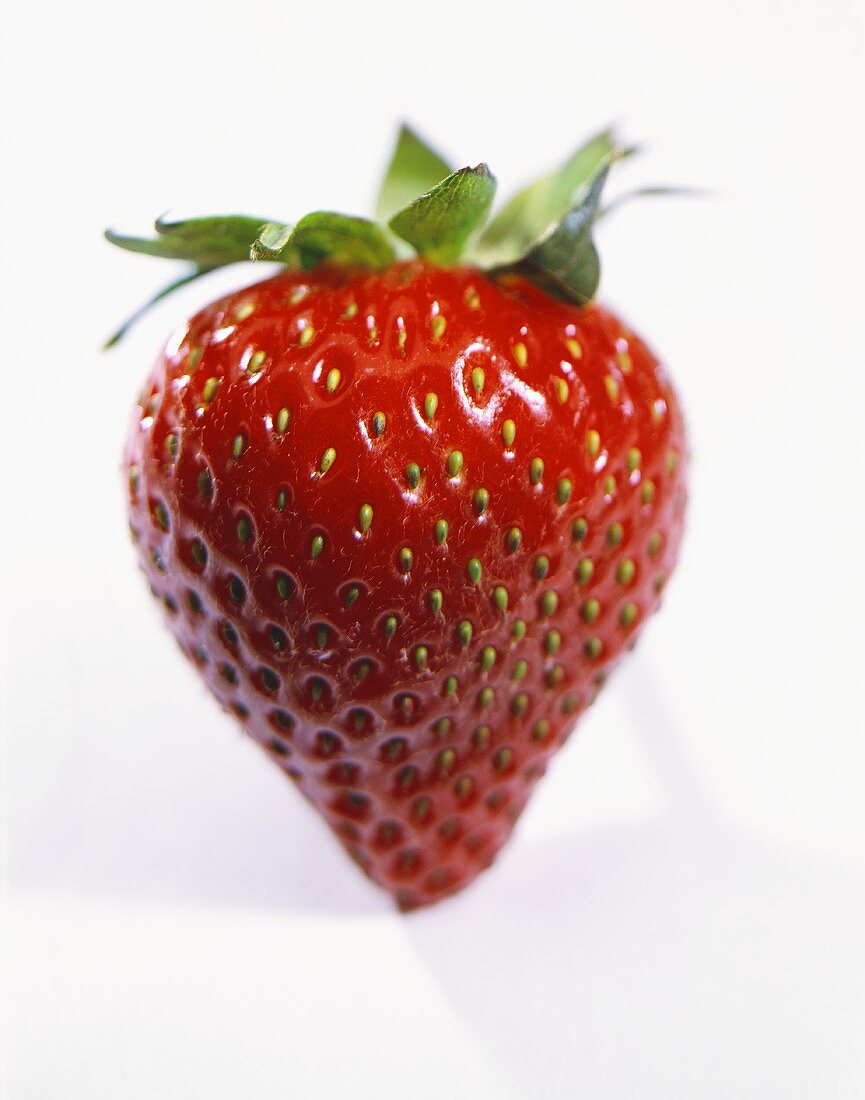 A Single Strawberry on White Background