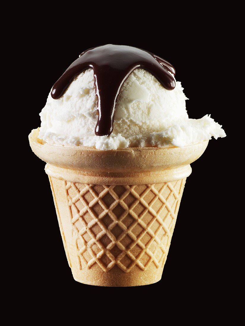 Vanilla ice cream with chocolate sauce in cone