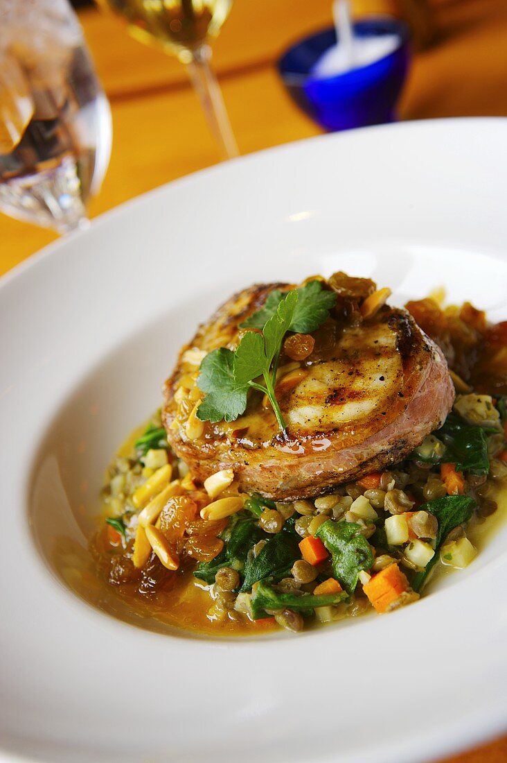 Prosciutto Wrapped Swordfish over Spinach and Lentil Salad