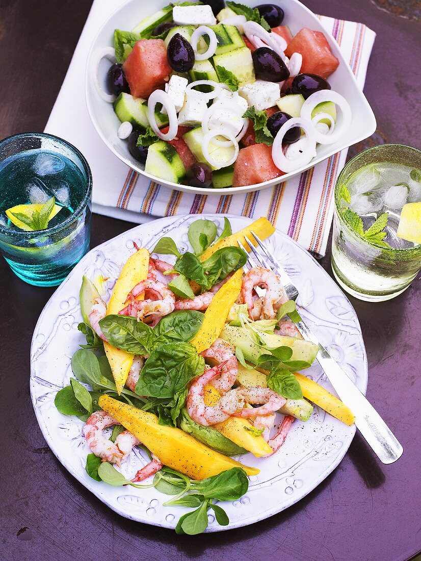 Prawn salad with mango and a Greek salad