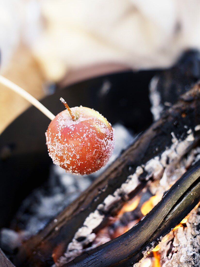 An apple being grilled
