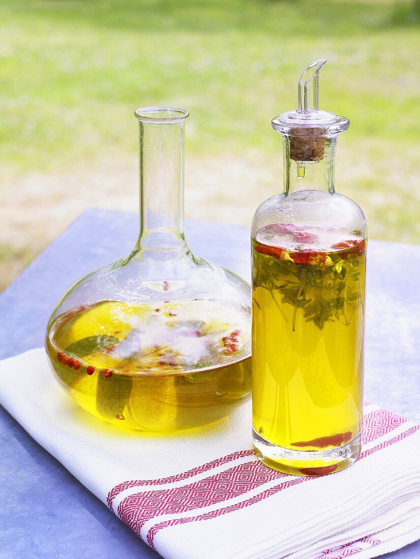 Herb oil in a bottle and in a carafe