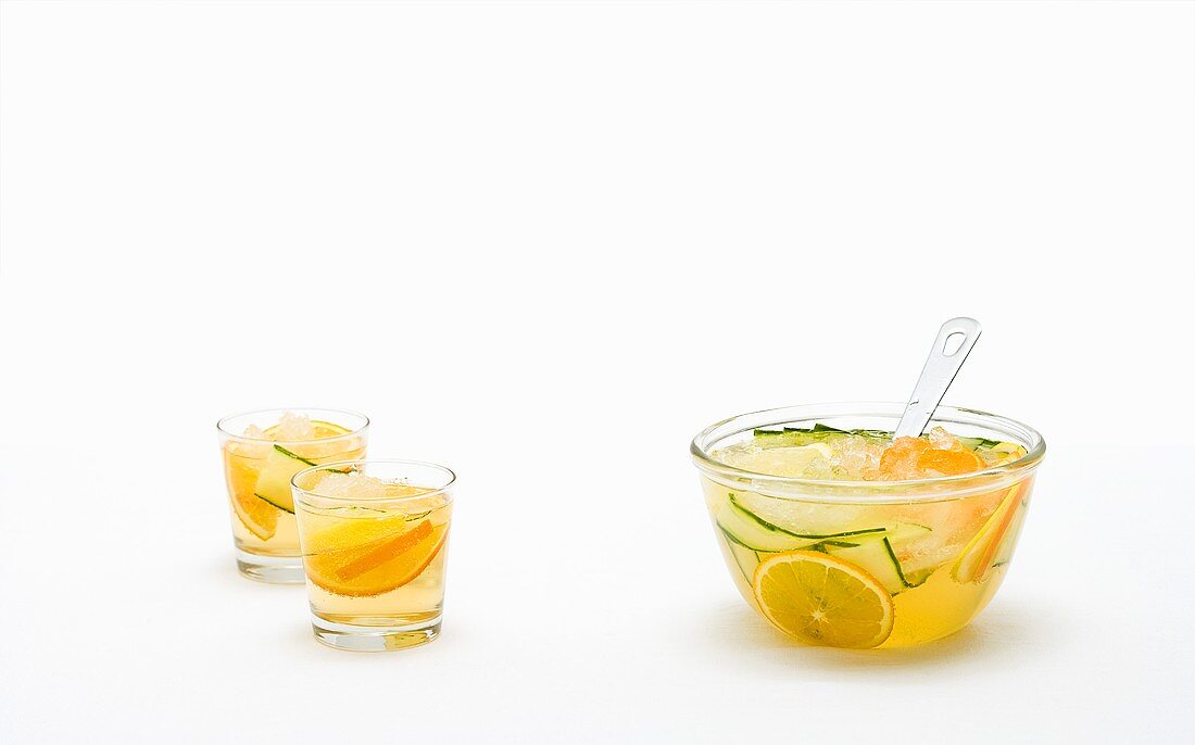 Fruit punch in jars and in a glass bowl