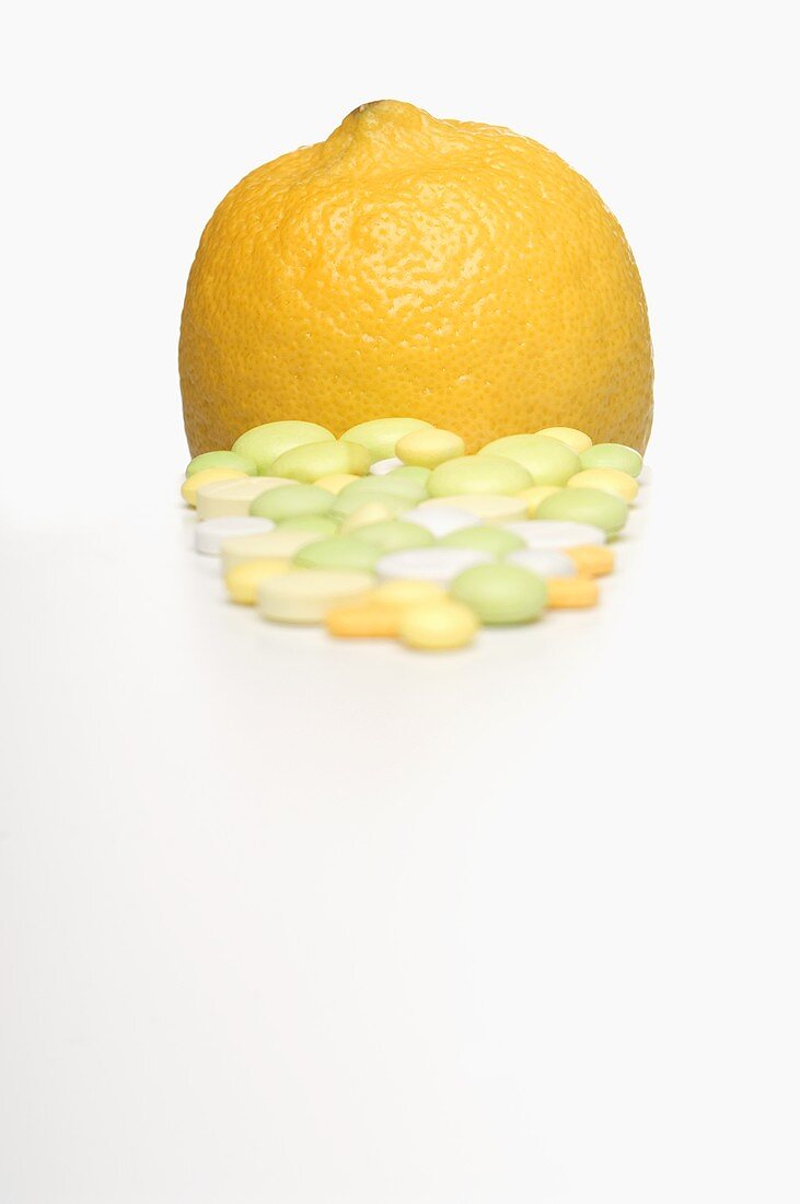 Vitamin tablets and a lemon