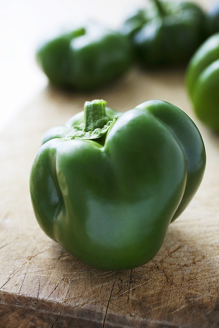 Green peppers on a chopping board