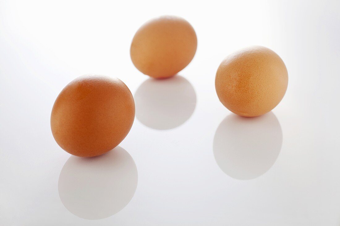 Three brown eggs