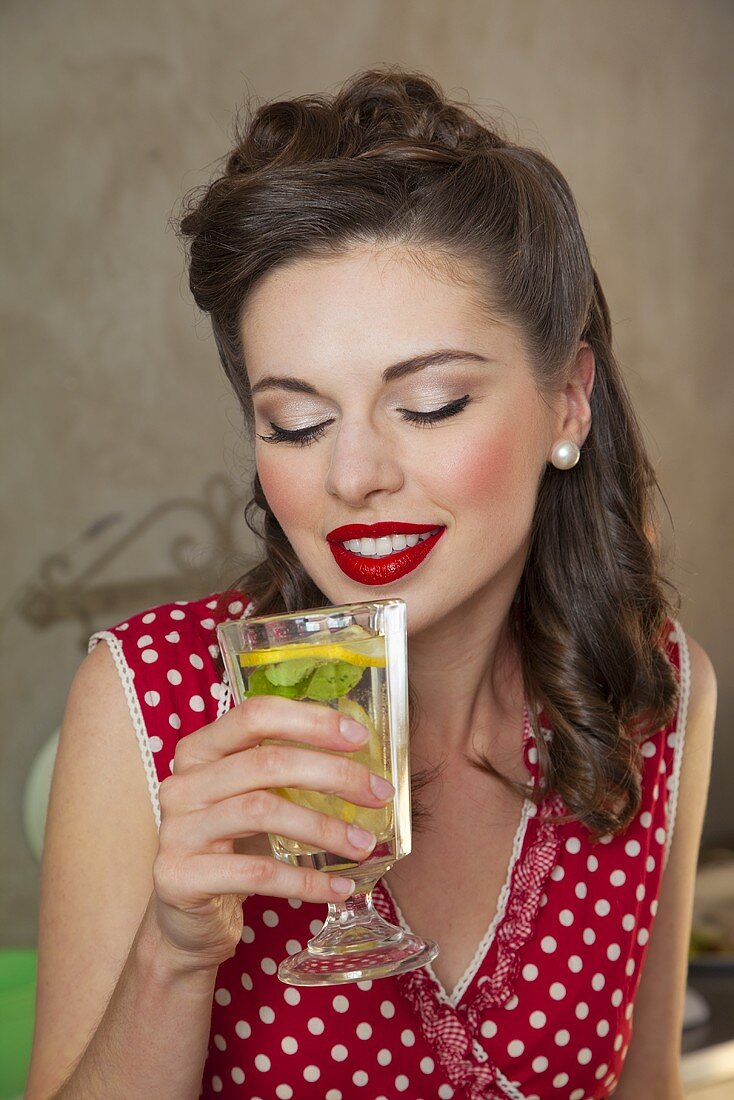 A retro-style girl drinking lemonade
