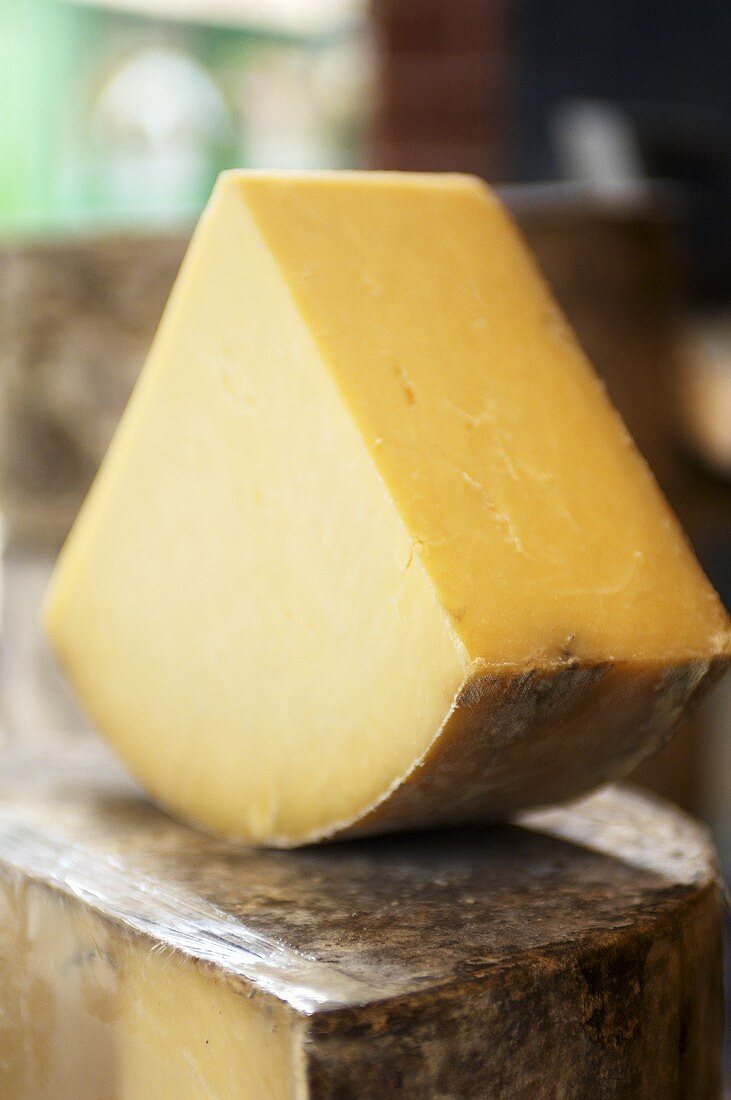 A piece of Cheddar cheese made of unpasteurised milk