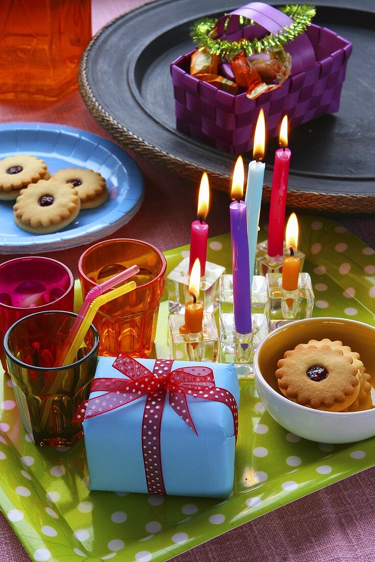 Birthday cakes, candles and jam biscuits