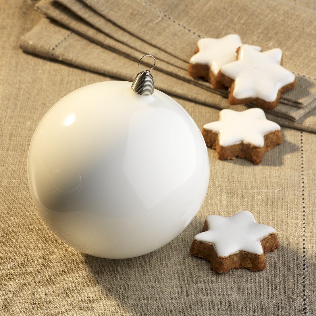 Cinnamon stars and white a Christmas bauble