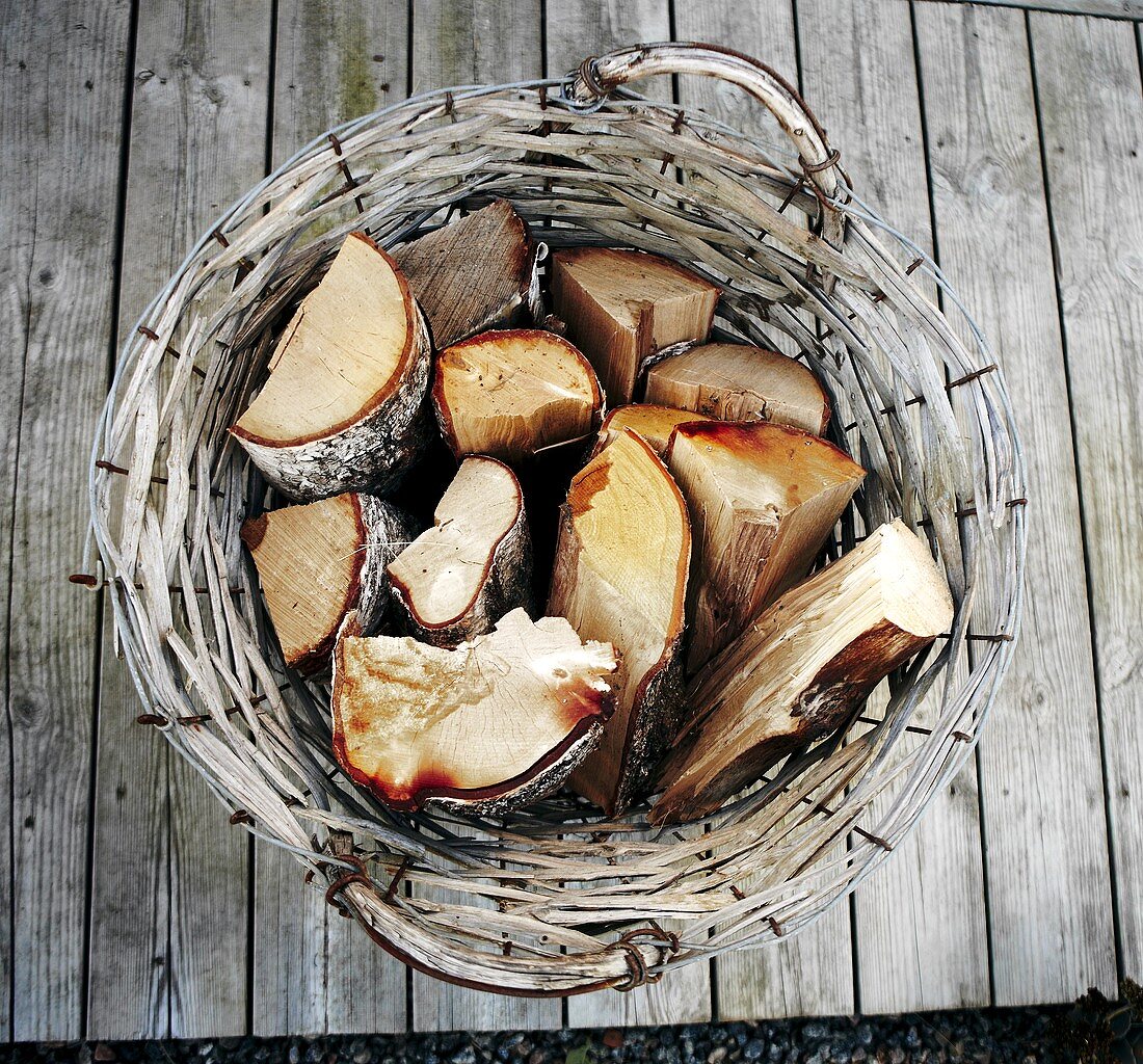 Firewood in a willow basket, seen from above