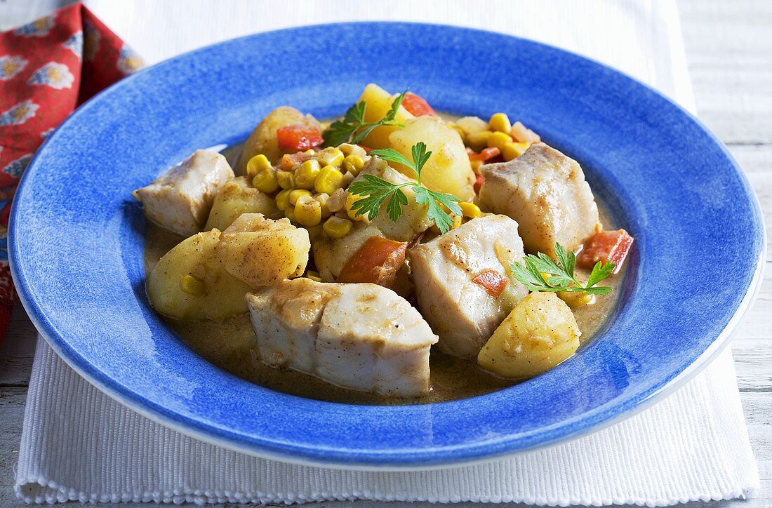 Fish curry with potatoes and sweetcorn