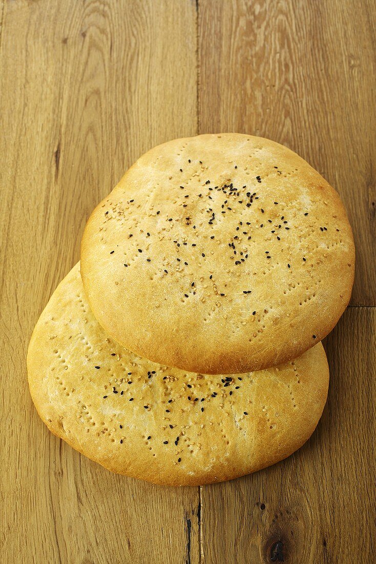 Oriental unleavened bread on a wooden table