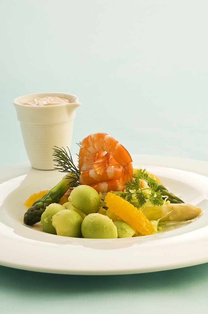 Shrimp cocktail with avocado, oranges and asparagus