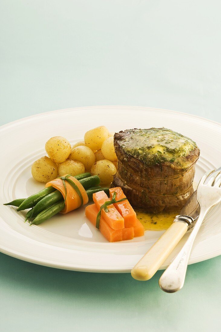 Beef fillet with parsley butter and a side of vegetables