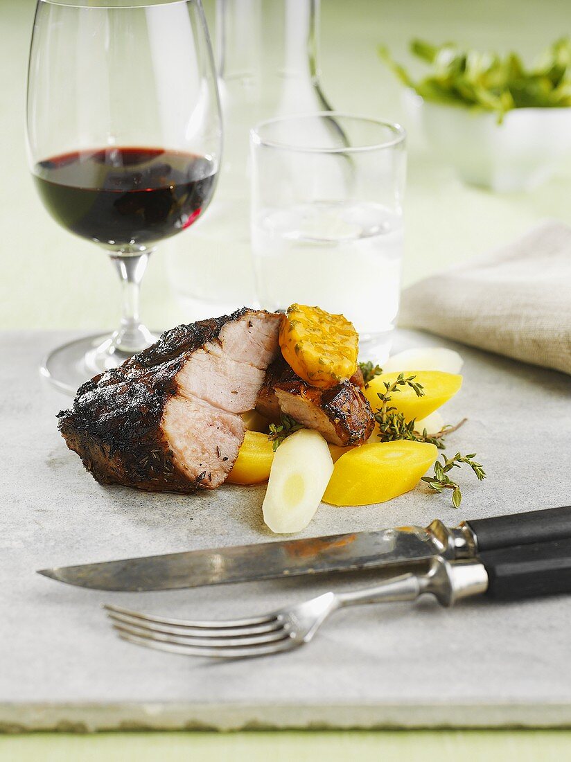 Roast pork with root vegetables and red wine