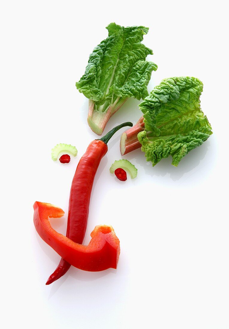 A vegetable face made with a chilli pepper, rhubarb and pepper