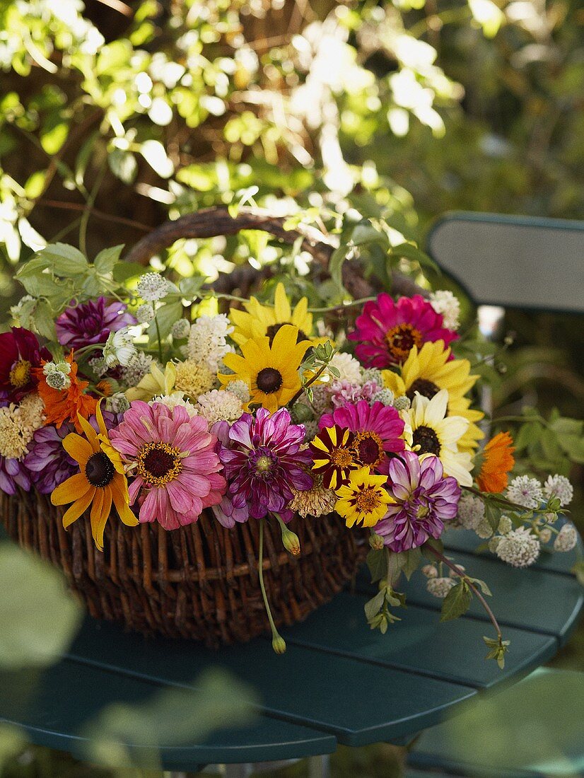 A summery bouquet in a willow basket