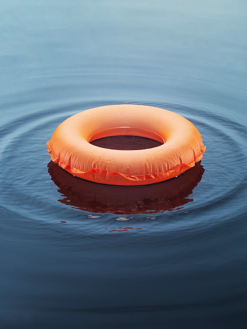 Life preserver on the surface of the water