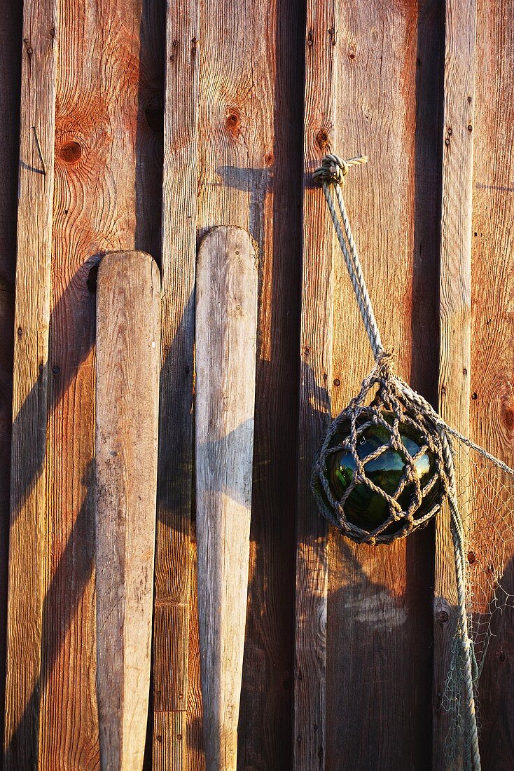 Fishing gear on a wooden wall