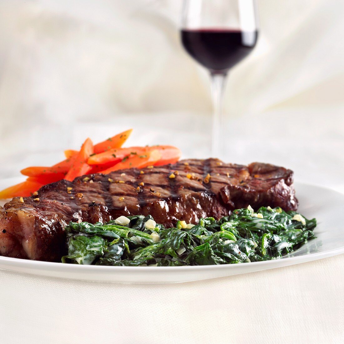 Grilled Steak with Creamed Spinach and Carrots