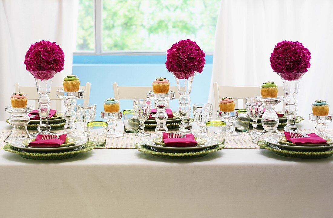 A festively laid table with flower balls