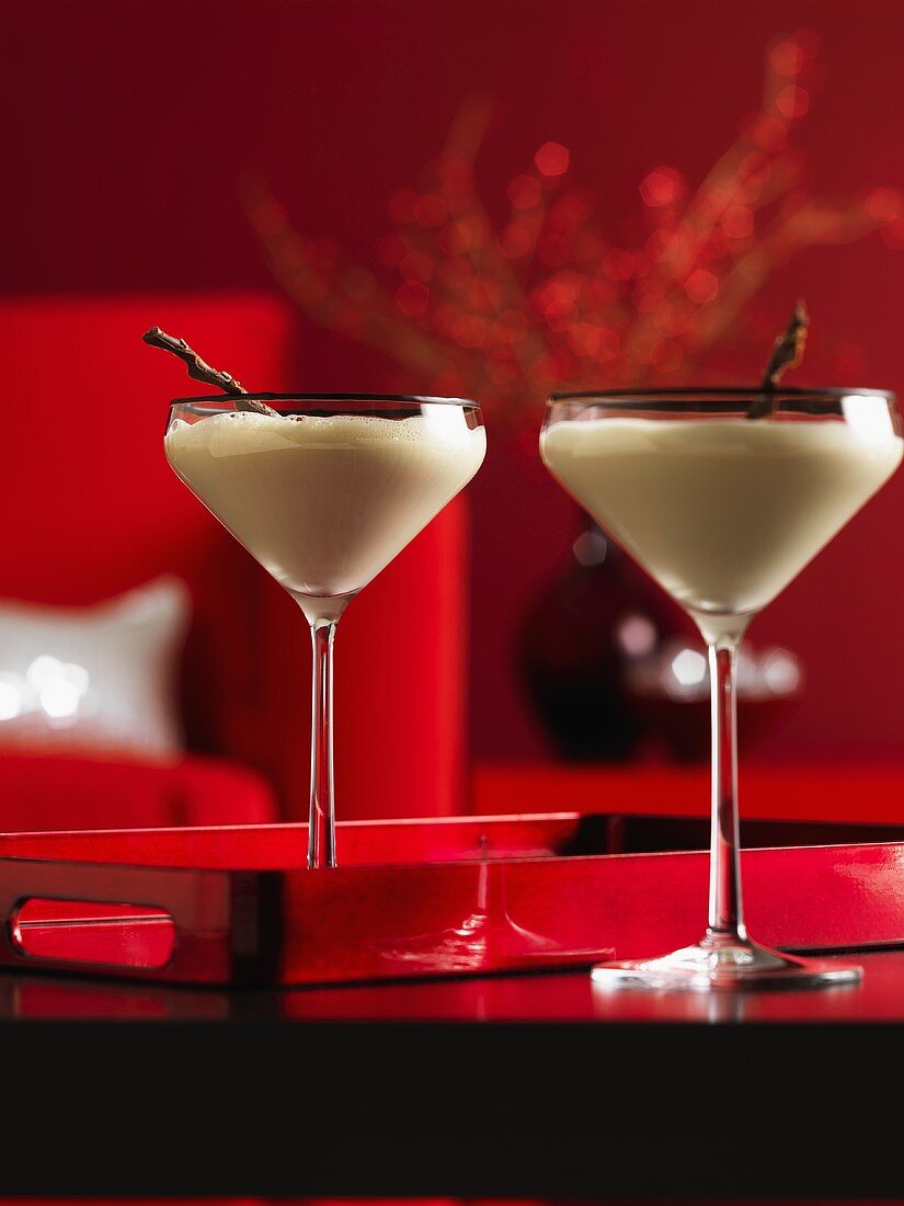 Two cream cocktails in Martini glasses