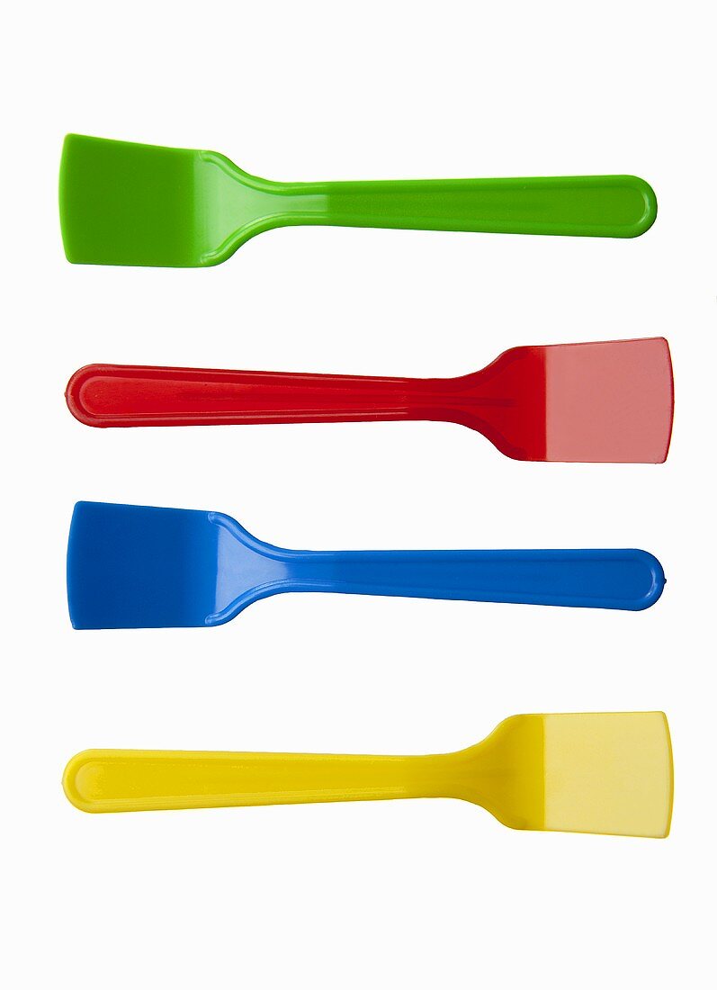 Four brightly colored ice cream spoons