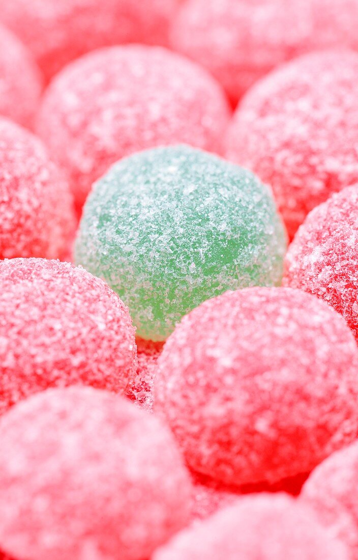 Pink jelly tots with a green jelly tot