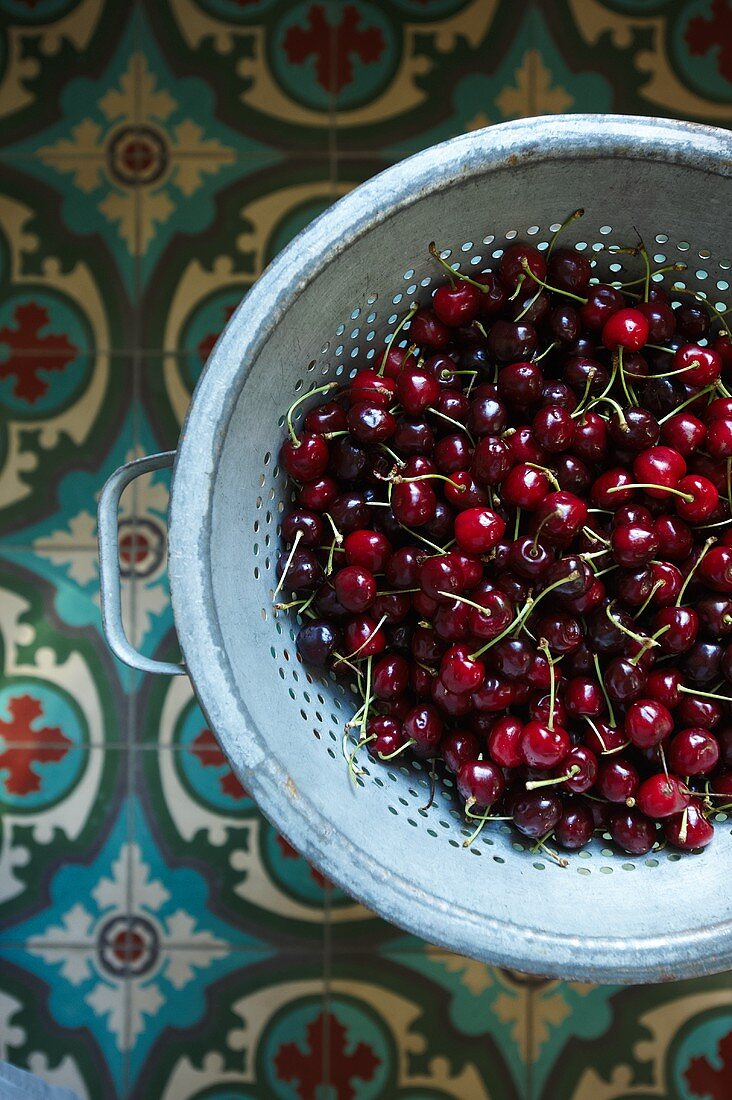 Bing Cherries with Stems in a Colander; From Above