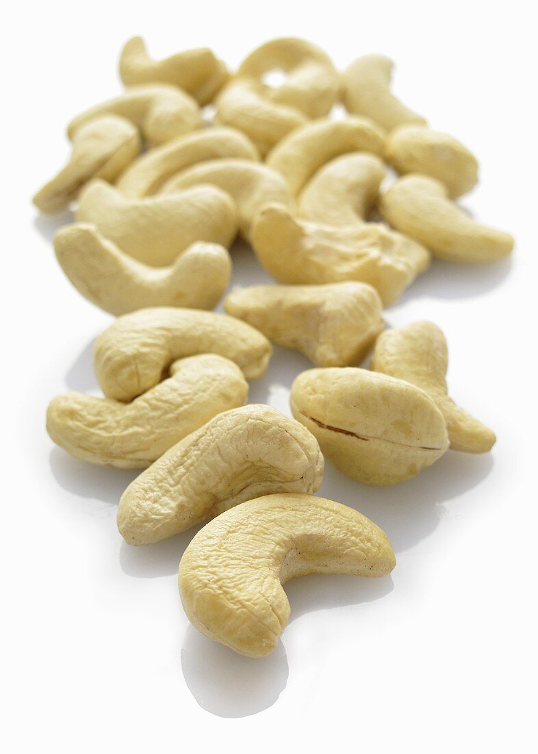 Cashew nuts on a white surface