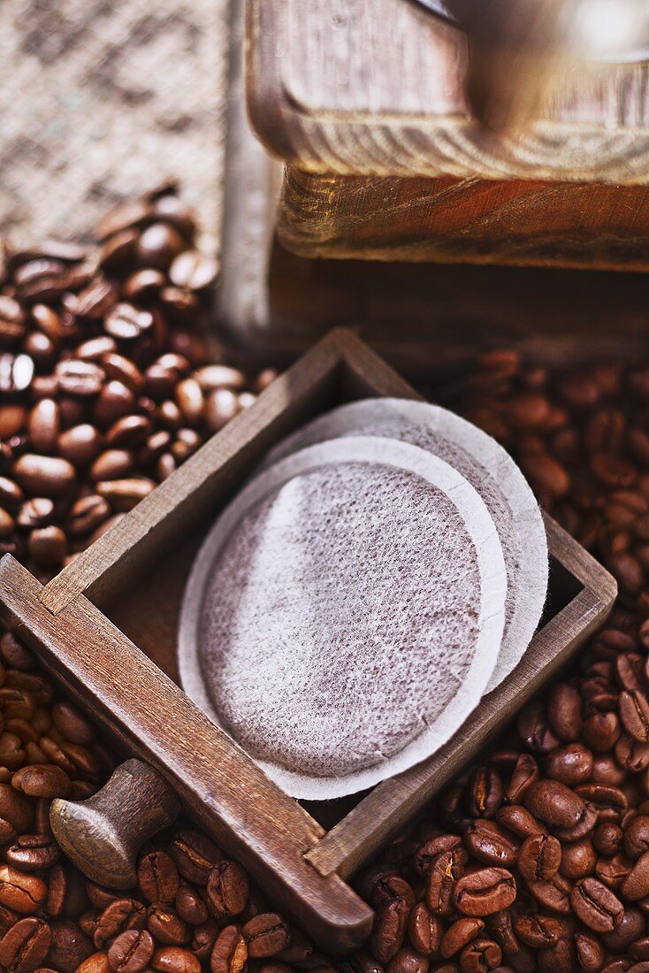 Coffee pads, a coffee mill and coffee beans
