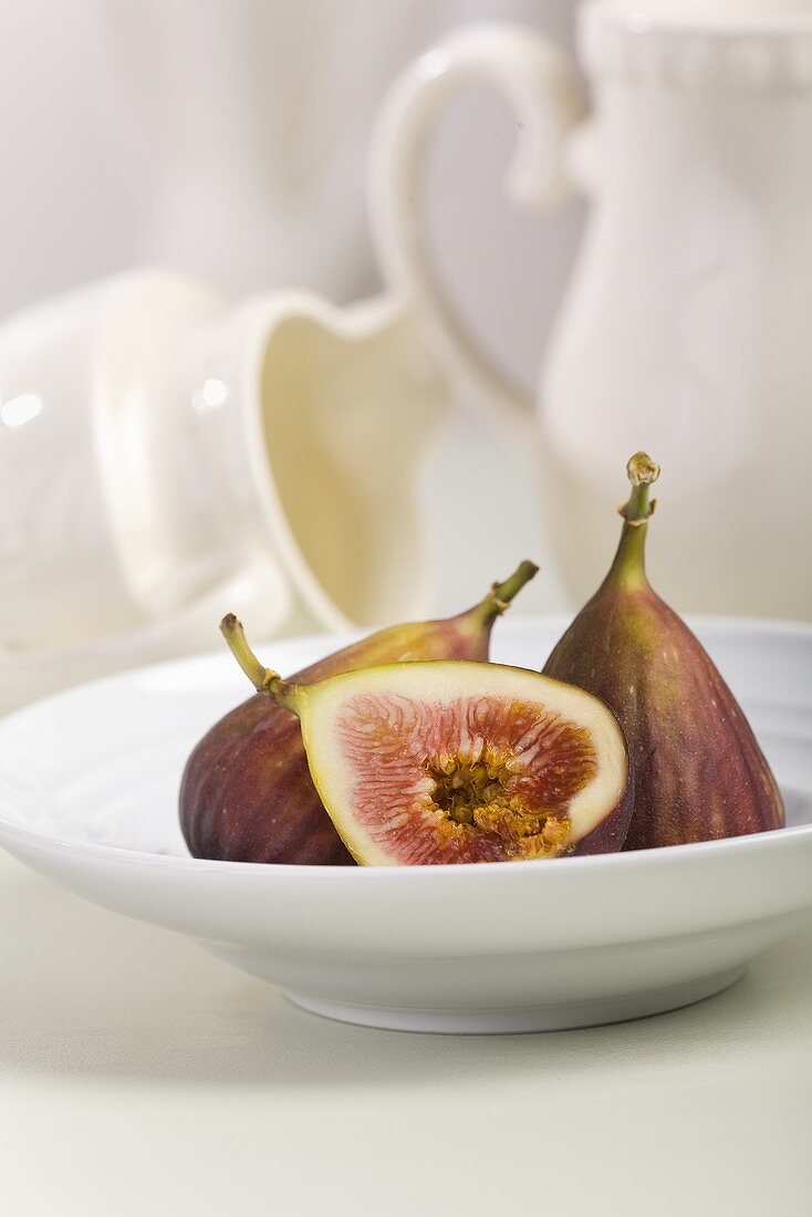 Figs; Half and Whole in a White Bowl; Pitchers