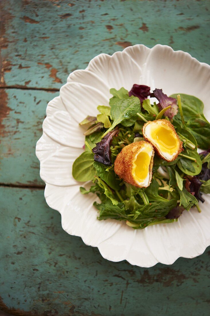 Fried Poached Egg Over Mixed Greens